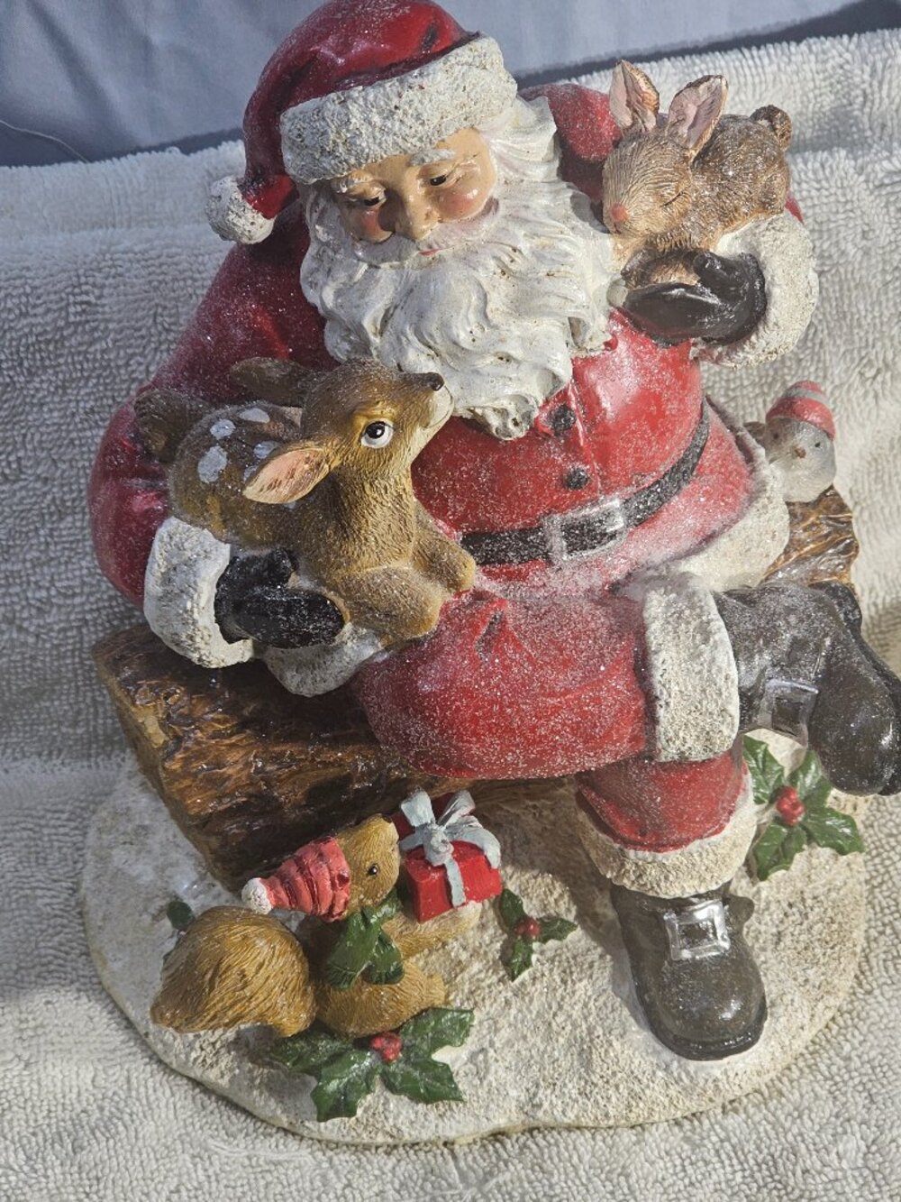 RAZ Imports Snowy Woodland Santa Sitting on Log Figurine with Fawn and Forest An